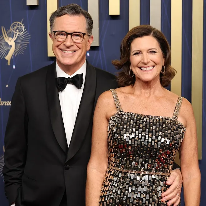 Stephen Colbert and Evie McGee Colbert smiling and standing close together.
