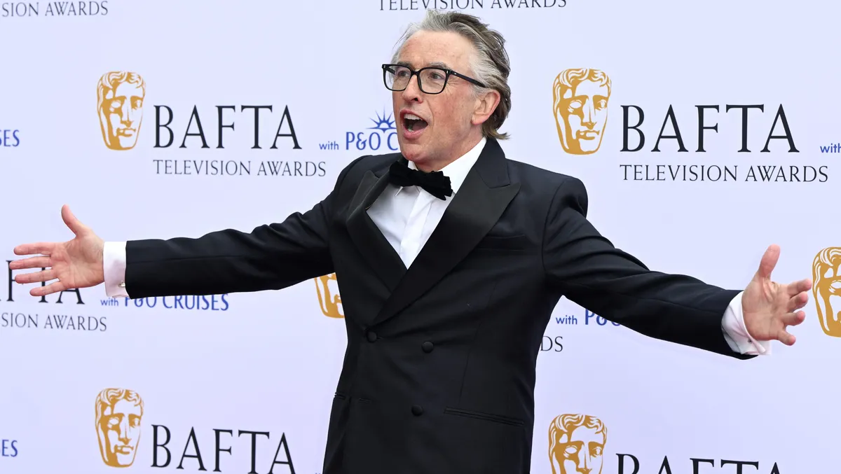 Steve Coogan on a red carpet.