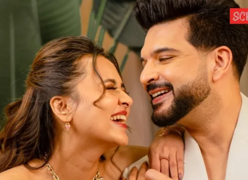 Tejasswi Prakash and Karan Kundrra smiling together at an event