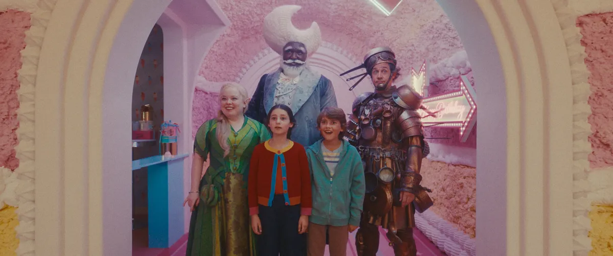 A still from The Magic Faraway Tree movie showing children looking up at a magical treehouse.