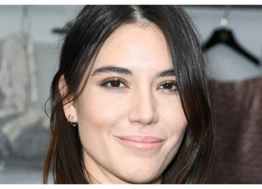 Actress Nathalia Acevedo smiling during an event.
