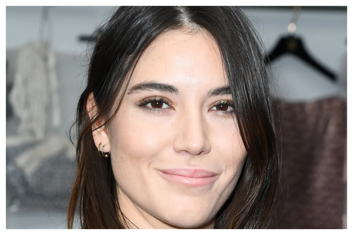 Actress Nathalia Acevedo smiling during an event.