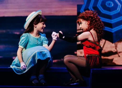 Jessica Vosk and Kelli Barrett performing on stage in the musical Beaches.