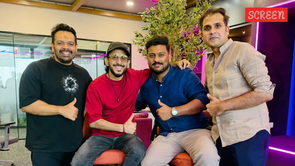 Aman Gupta smiling next to Flying Beast founders.