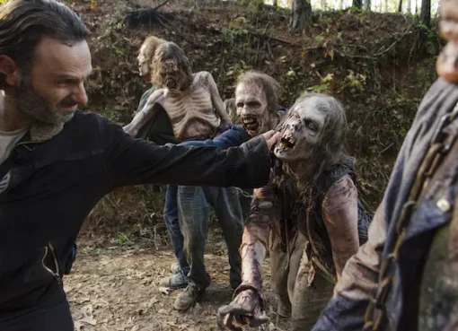 A group of survivors from The Walking Dead looking out at a desolate landscape.