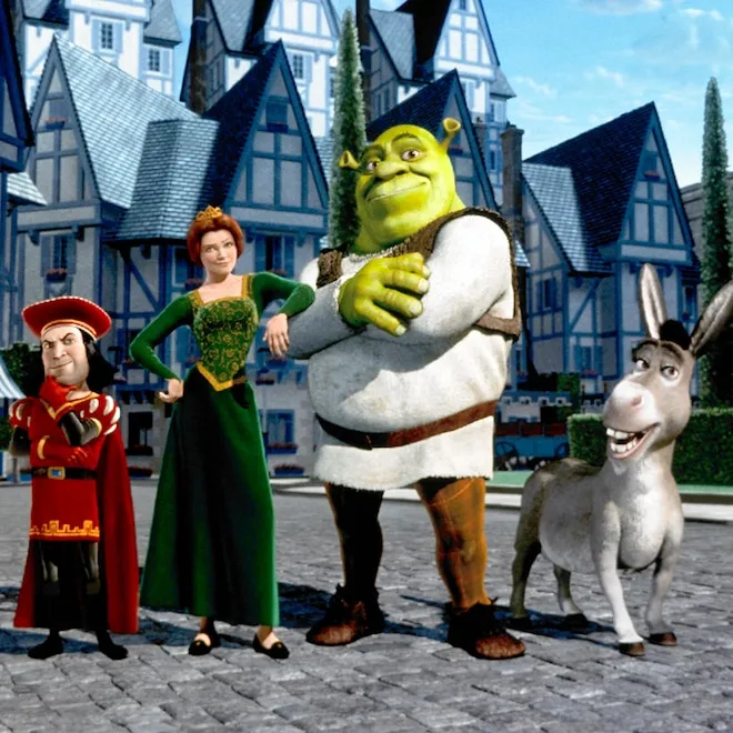 Shrek smiling, a green ogre character from the popular animated film, in his swamp home.