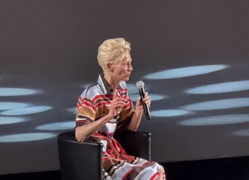 Tilda Swinton on the red carpet at Cannes Film Festival, looking stylish and thoughtful.