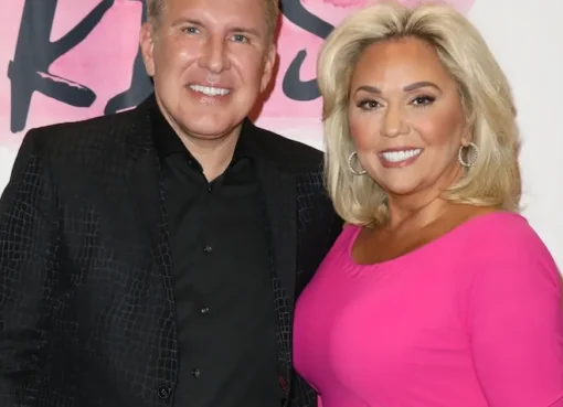 Todd Chrisley posing and smiling for a photograph.