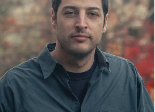 Adam Meeks, director of the acclaimed film 'Union County', smiling.