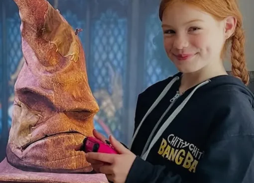 Gracie Cochrane as Ginny Weasley in a Hogwarts setting.