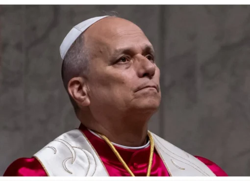 Pope Leo XIV speaking to a crowd with a serious expression, discussing artificial intelligence.