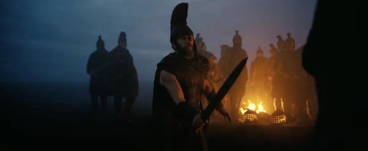 A dark and cinematic movie still from The Odyssey trailer showing a stormy sea.
