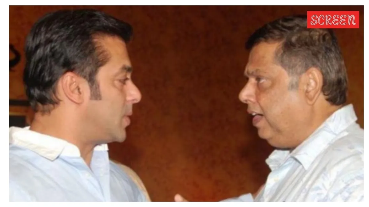 Varun Dhawan sharing a candid moment, discussing his dad David Dhawan and Salman Khan.