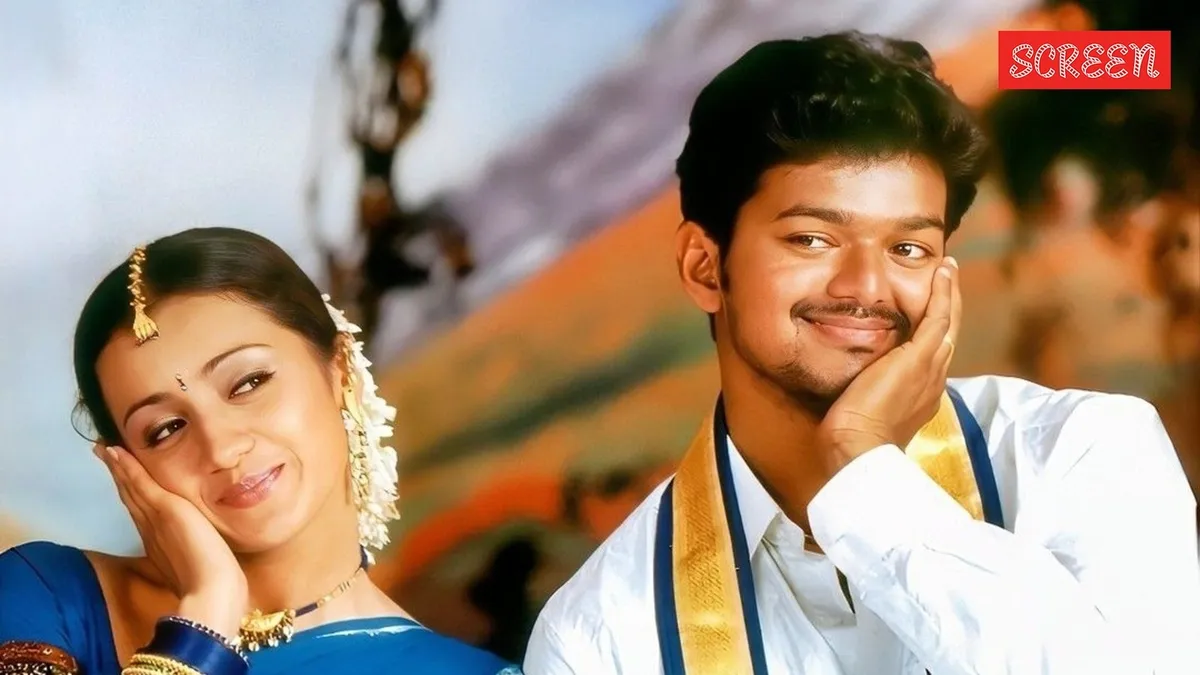 Photo of Trisha Krishnan and Vijay smiling together.