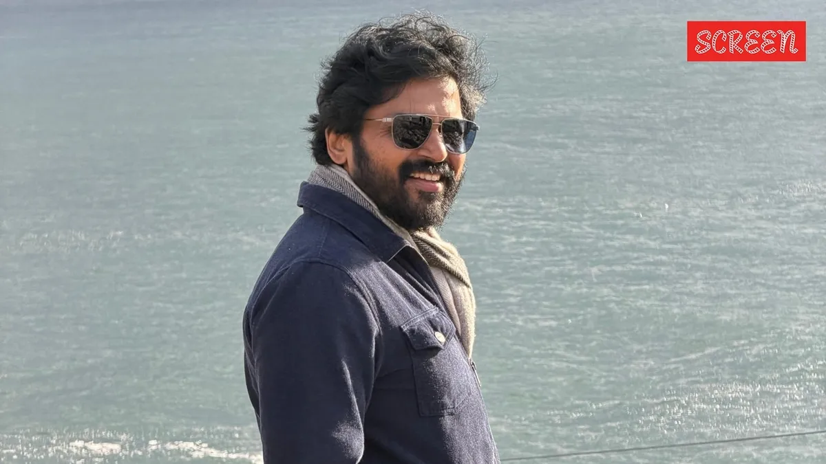 Karthi, the actor, smiling brightly