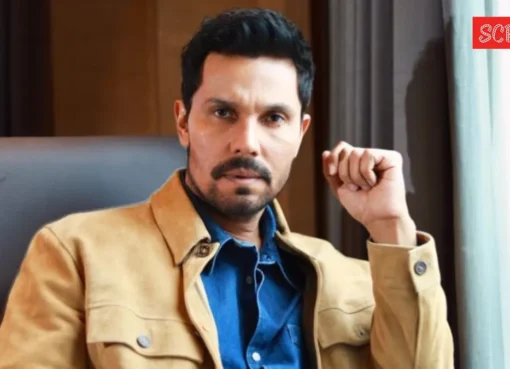Randeep Hooda looking thoughtful at an event.