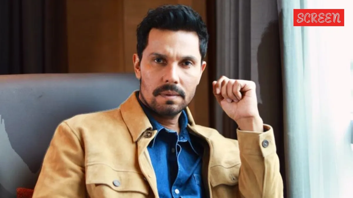 Randeep Hooda looking thoughtful at an event.