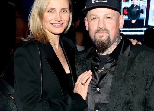 Cameron Diaz and Benji Madden walking and laughing together