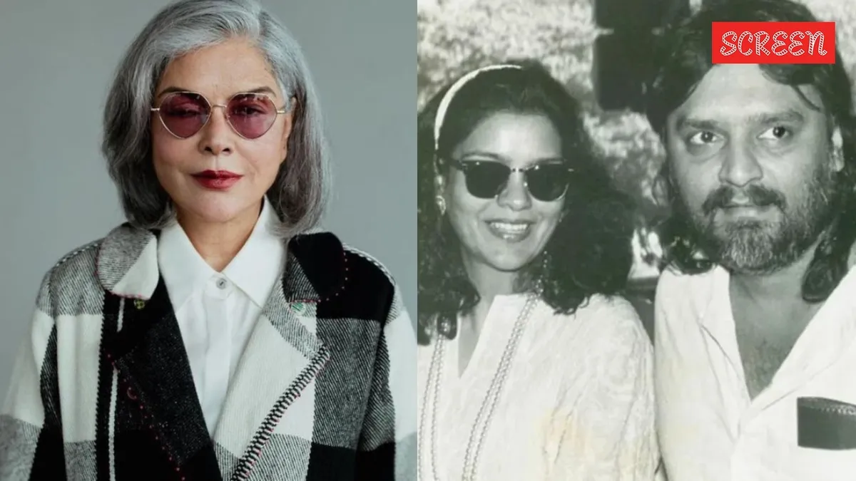 Zeenat Aman looking reflective, a soft focus capturing a moment of deep thought.