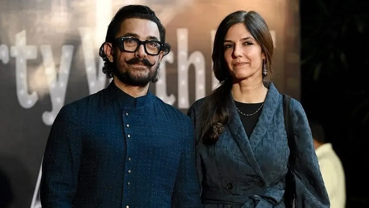 Aamir Khan and Gauri Spratt smiling at a private event.