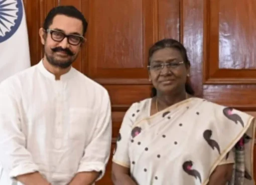 Aamir Khan smiling, possibly at a film announcement.