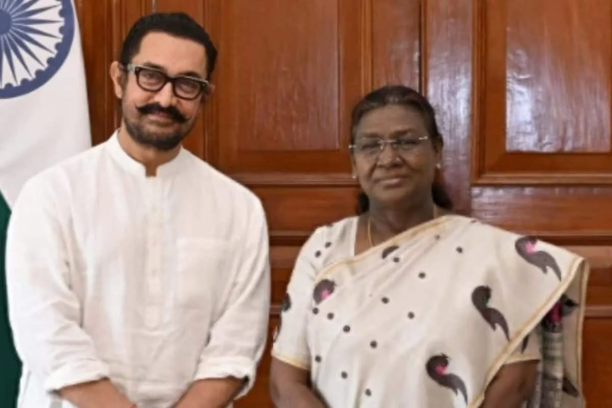 Aamir Khan smiling, possibly at a film announcement.