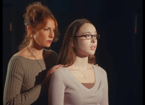 A still from Sophia Takal's 'Act One' featuring a woman looking intensely.