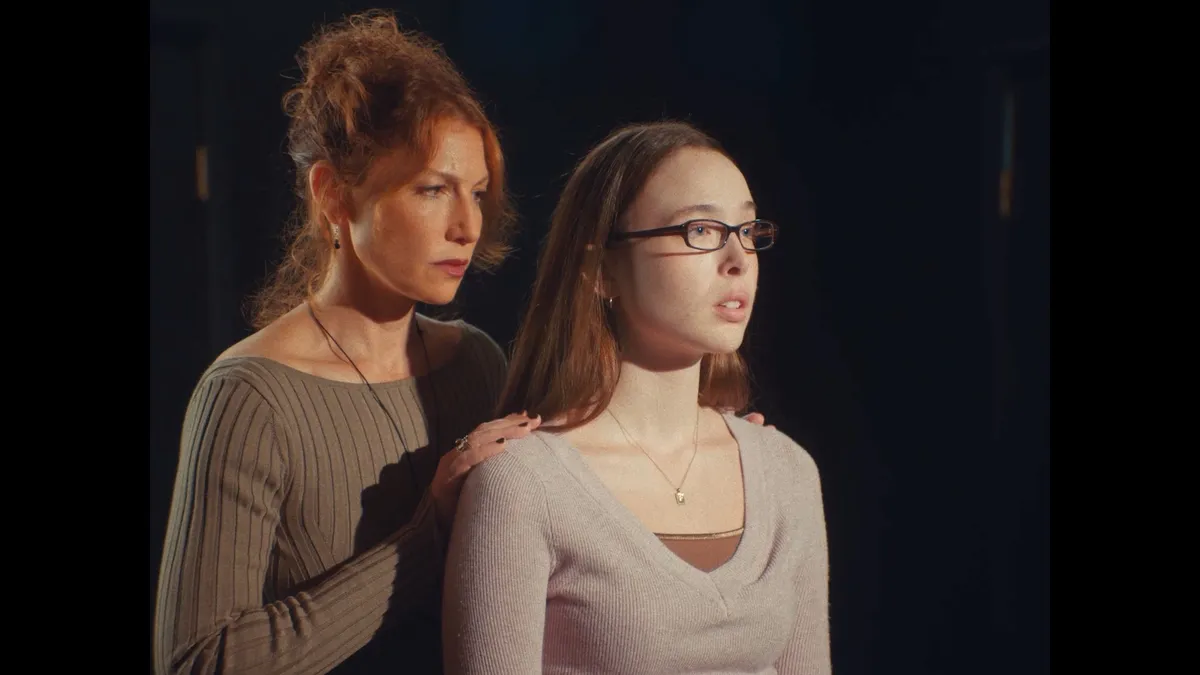 A still from Sophia Takal's 'Act One' featuring a woman looking intensely.
