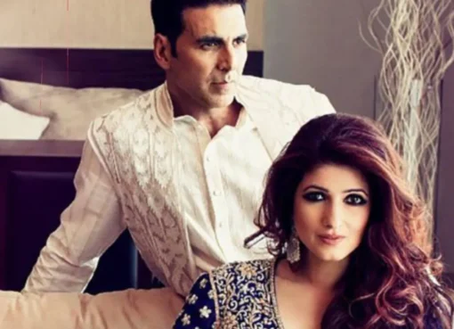 Akshay Kumar and Twinkle Khanna smiling brightly together at an event.