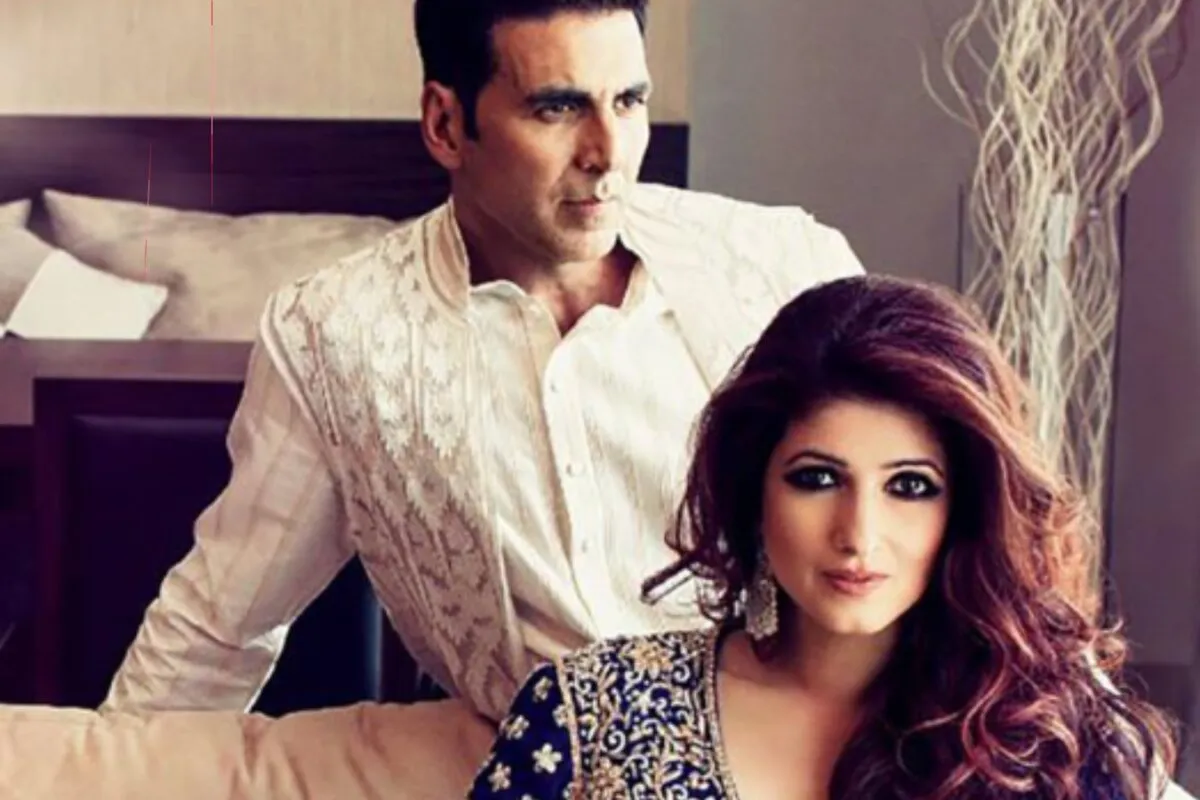 Akshay Kumar and Twinkle Khanna smiling brightly together at an event.