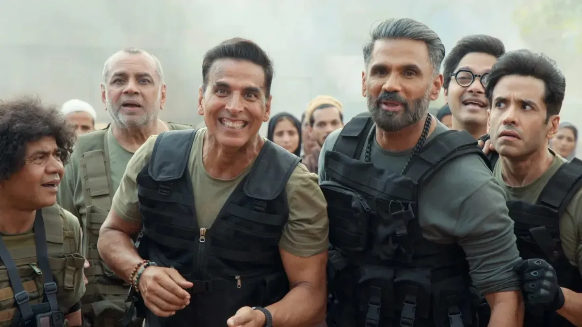 Akshay Kumar in a jungle setting, looking intense with a determined expression.