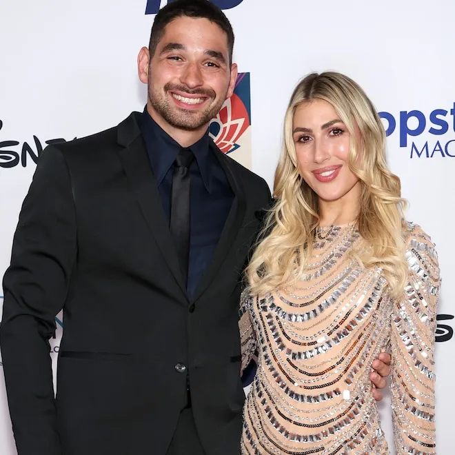 Alan Bersten and Emma Slater smiling and posing together.