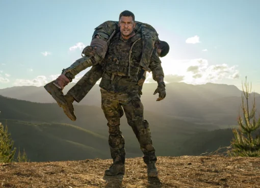 Alan Ritchson, looking serious, in military uniform for 'War Machine'.