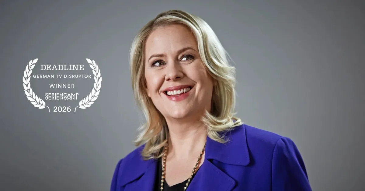 Anke Greifeneder, a woman with a determined look, smiling slightly, possibly in a professional setting.