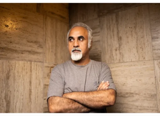 Portrait of director Nader Saivar looking thoughtful at a film festival.