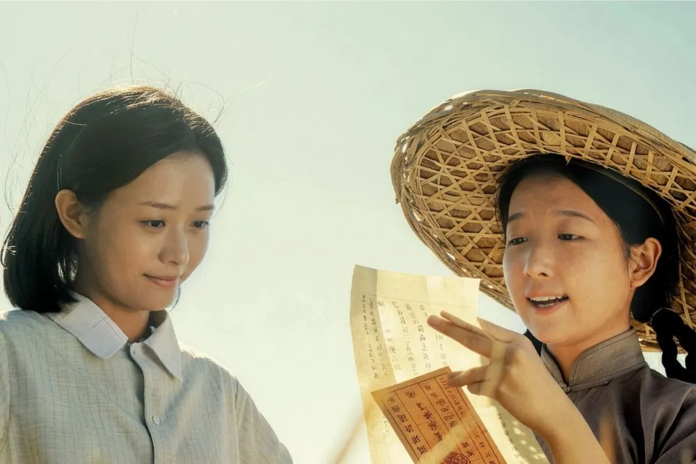 A heartwarming still from the Chinese movie 'Dear You' featuring a young boy and an older woman.