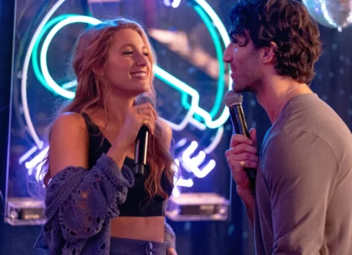 Blake Lively smiling brightly, celebrating a court victory.