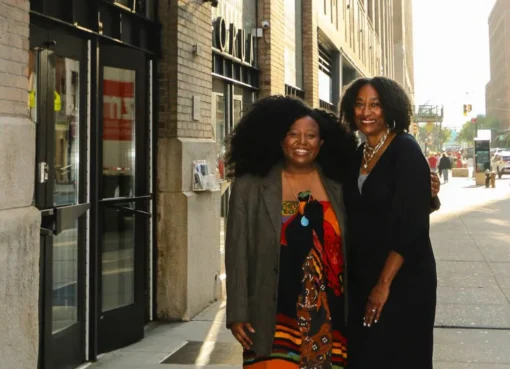 Bridgett M. Davis smiling, likely on a film set with a camera in the background.