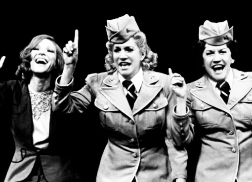 A photo of Janie Sell smiling on stage.