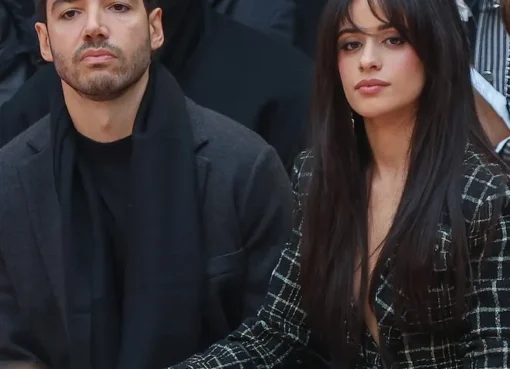 Camila Cabello looking thoughtful, with an implied background of a fading romance.
