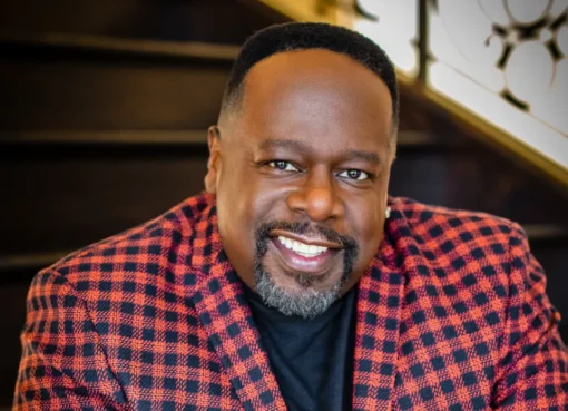 Cedric the Entertainer smiling on stage.
