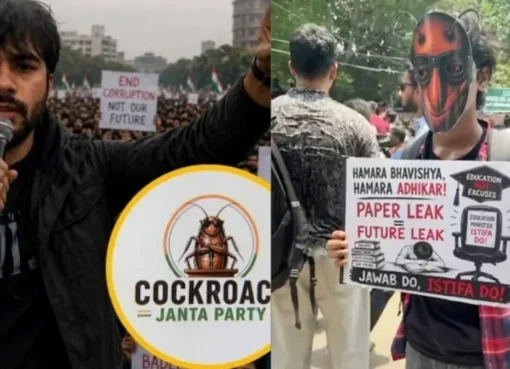 A protest sign with a stylized cockroach symbol being held up amidst a crowd at Jantar Mantar, Delhi.