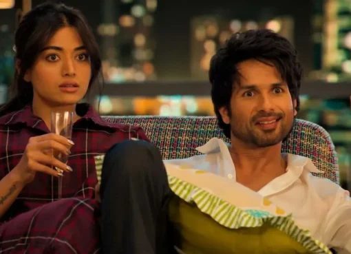 Shahid Kapoor and Rashmika Mandanna smiling at a film event, looking hopeful.
