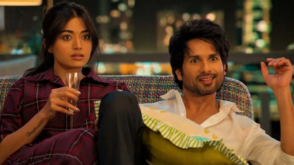 Shahid Kapoor and Rashmika Mandanna smiling at a film event, looking hopeful.