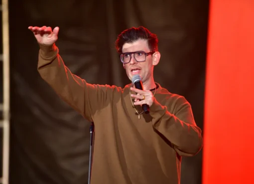Comedian Moshe Kasher smiling.