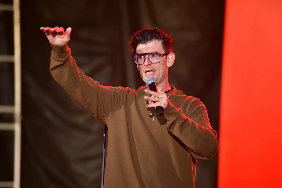 Comedian Moshe Kasher smiling.