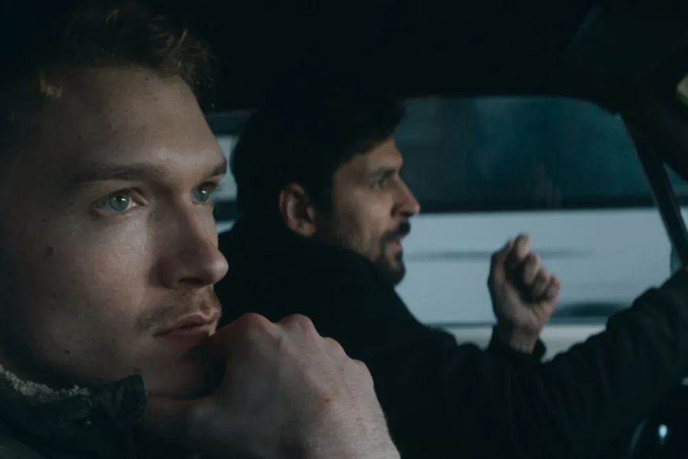 A director looking thoughtfully into the distance.