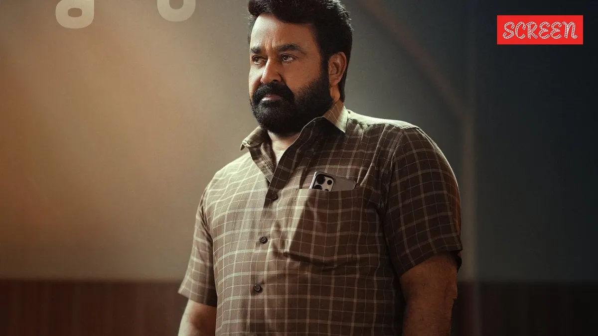 Ajay Devgn in a tense, thoughtful scene from Drishyam 3, hinting at suspense.