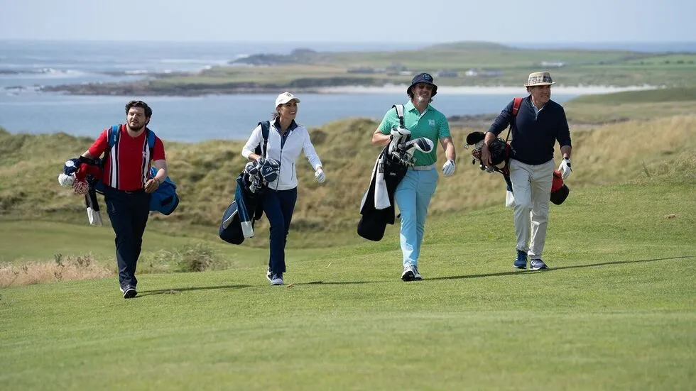 A scene from Edward Burns' movie 'Finnegan's Foursome' showing characters on a golf course.