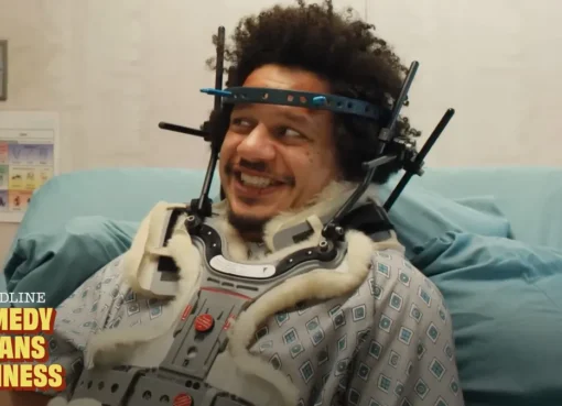 Eric Andre laughing intensely on a stage.